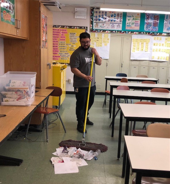Mr. Andrew prepares QPA classroom for learning