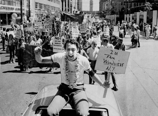 Openly gay American politician, Harvey Milk (1930 - 1978) at the Gay Pride Parade, San Francisco, 23rd June 1978. He is holding a placard that reads: Im from Woodmere, NY. (Photo by Terry Schmitt/San Francisco Chronicle via Getty Images)